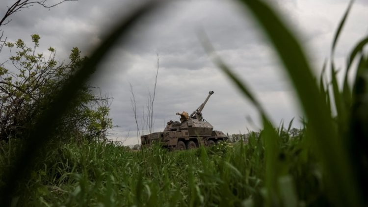 Ukrainian service members from a 110th Separate Mechanised Brigade of the Armed Forces of Ukraine, prepare fire a self-propelled howitzer “Dana” near the town of Avdiivka