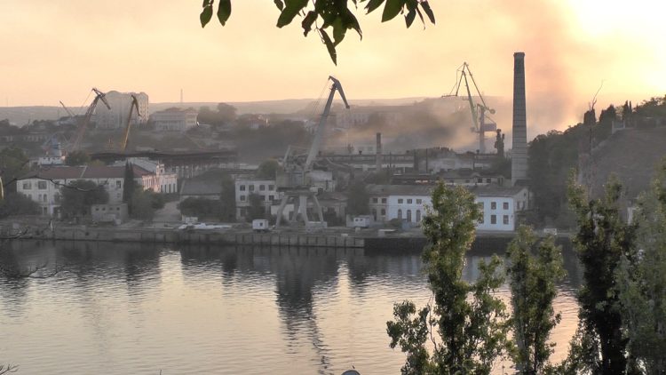 Smoke rises from the shipyard that was reportedly hit by Ukrainian missile attack in Sevastopol