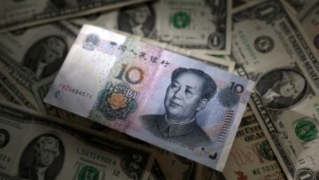 Illustration shows Chinese Yuan and U.S. dollar banknotes