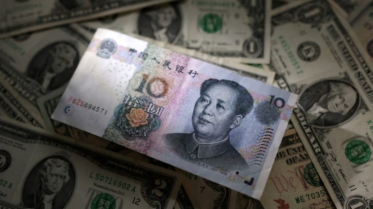 Illustration shows Chinese Yuan and U.S. dollar banknotes